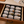 Load image into Gallery viewer, Wooden drawer with recipe cards organized in a black card holder on a kitchen counter.
